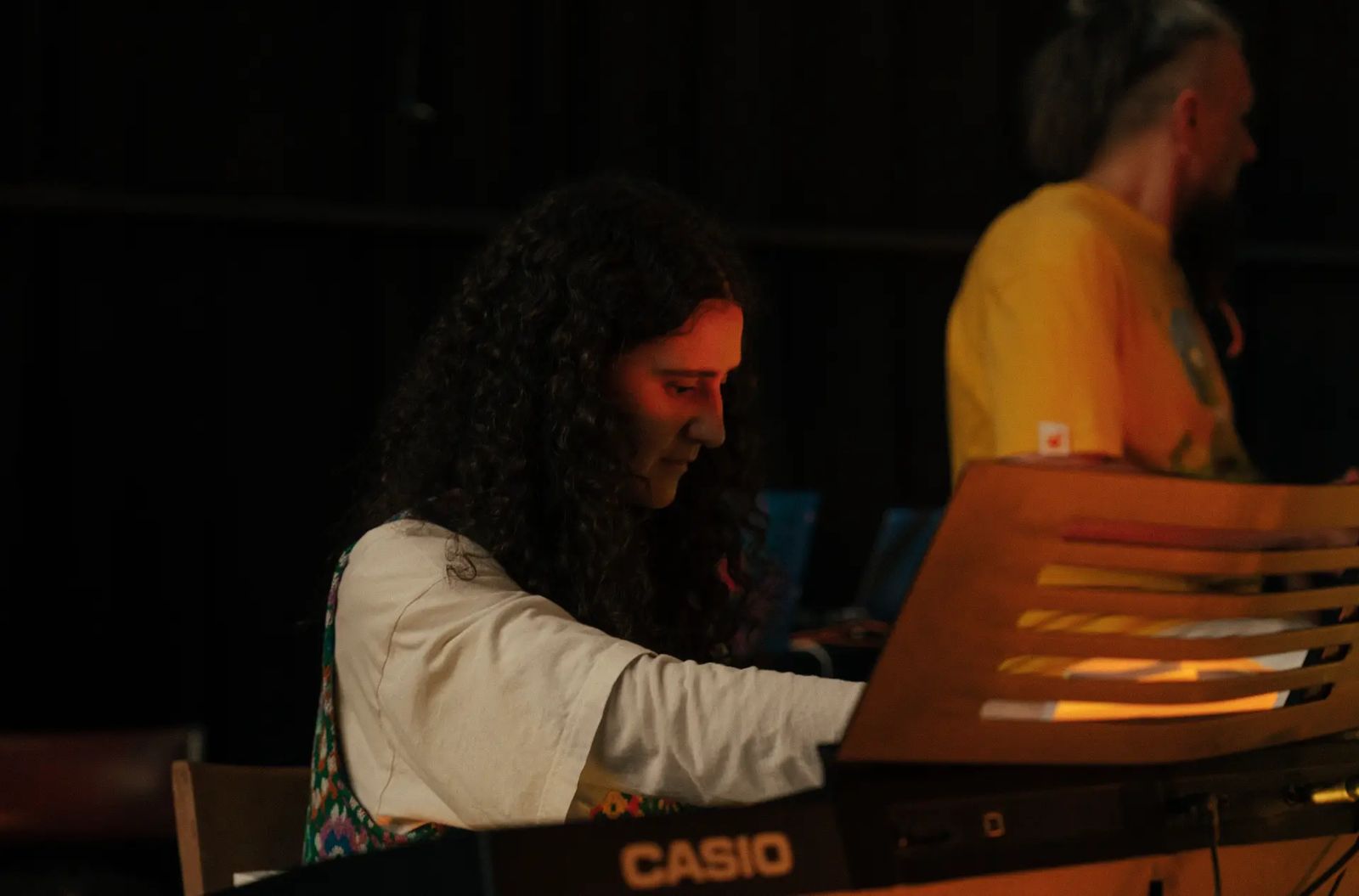Nurlana playing keyboard during the concert